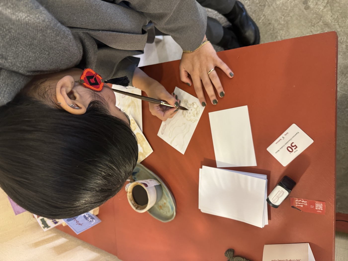 Jasmine Bahrami doing calligraphy